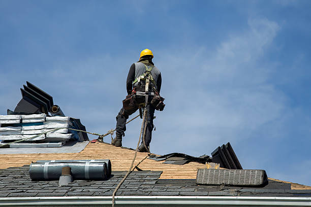 Professional Storm Damage Roof Repair technician working in Akron, IA